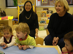 CJ and Calvin eagerly contemplate the cake as Grammy and I look on