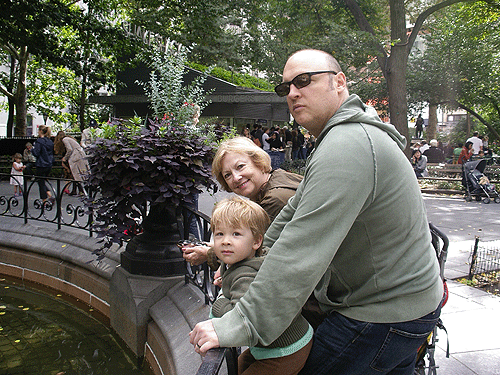 Calvin, Grammy and Jay hang out at the fountain in Madison Square Park, while a country band strikes up tunes in the background.