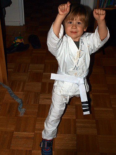 In sparring stance, something he is beginning to master... and part of the family practice at home.