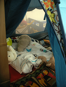 Inside our camp... you can see the abandonned bed through the tent window.